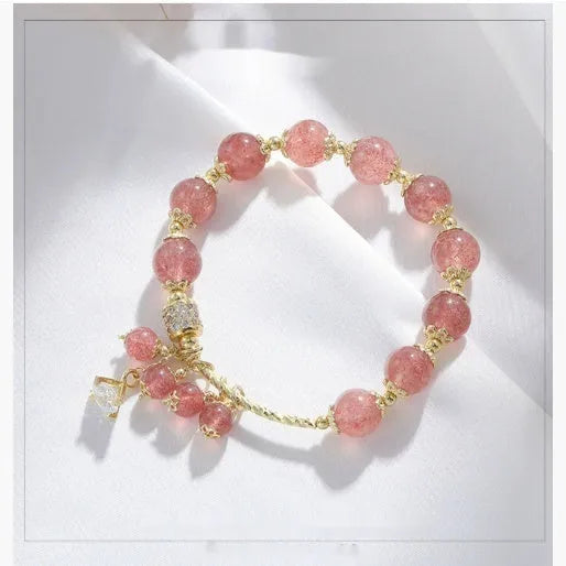 Pink crystal women's bracelet with heart-shaped charms and pearl decorative accents