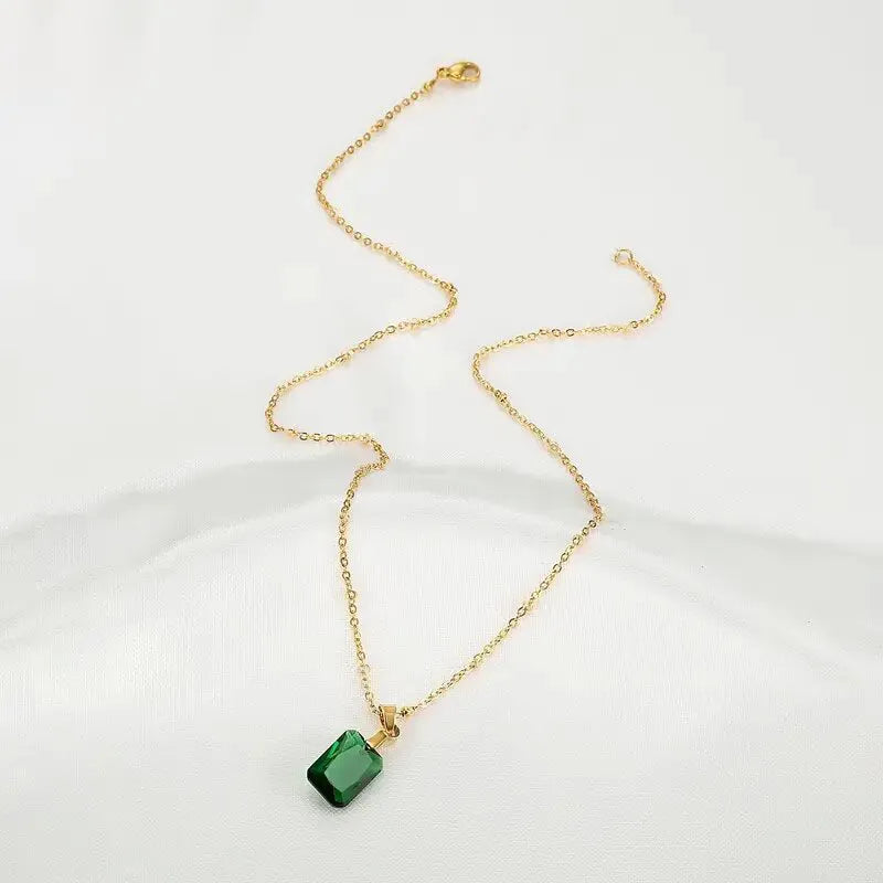 Copper geometric rectangular pendant necklace in XL1006 green on an O-ring chain.