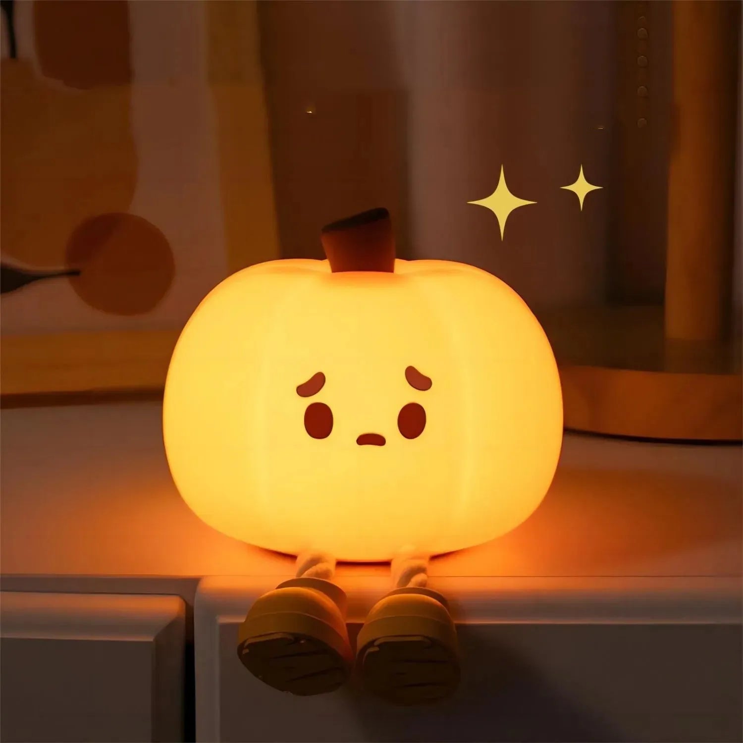 Soft silicone pumpkin-shaped night light with orange colour and touch dimming controls