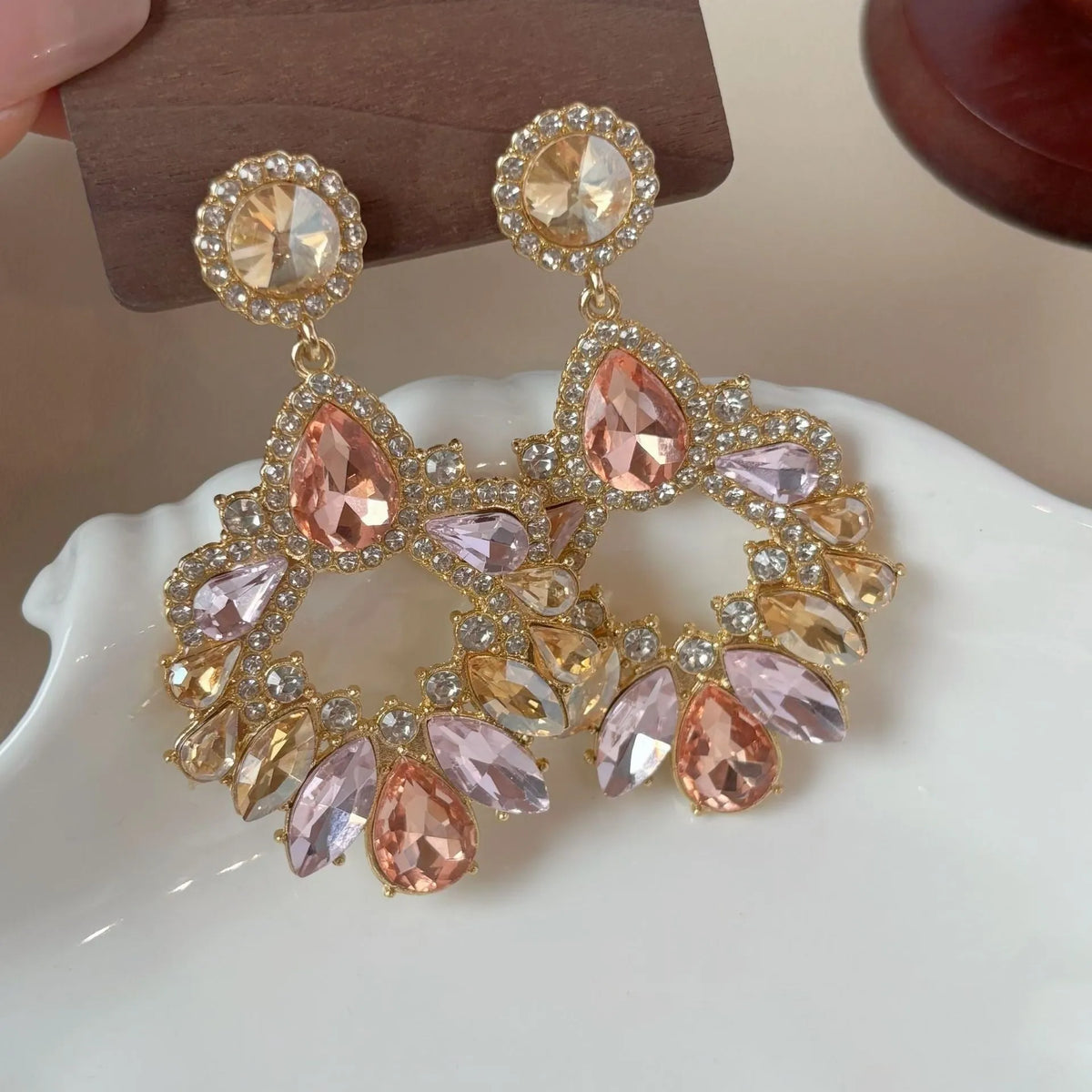 Pair of geometric rhinestone earrings with dot pattern on alloy base for women