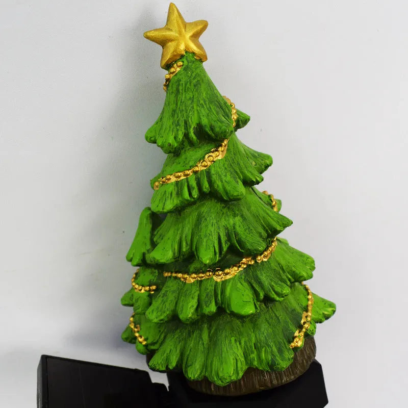 Solar powered Christmas tree shaped ground plugged lawn lamp with resin body and solar panel for outdoor garden decoration