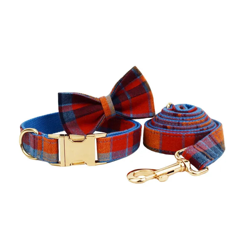 Blue velvet plaid dog collar with integrated hand-holding rope and leash set on cloth material