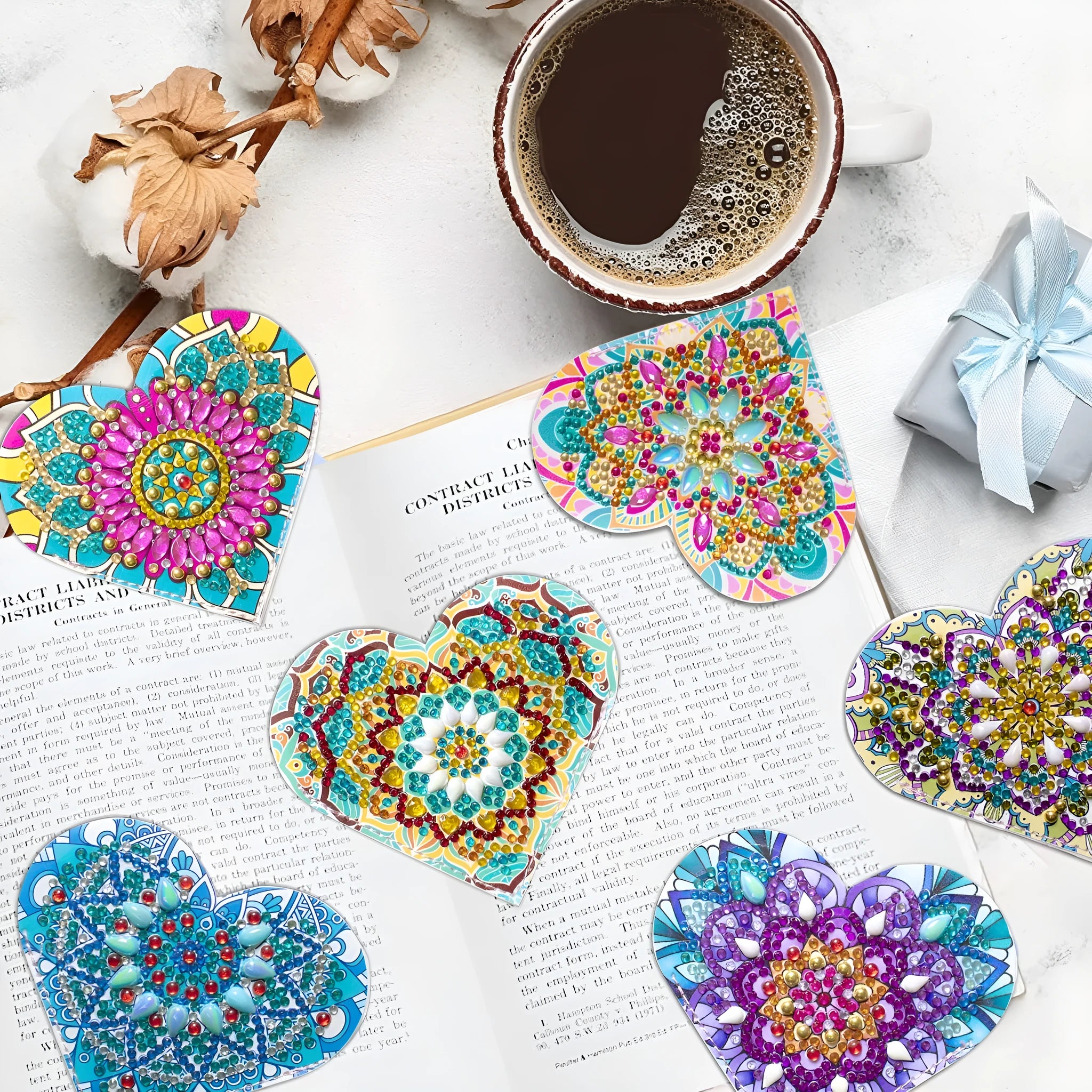Set of six handmade leather bookmarks with crystal flower designs.