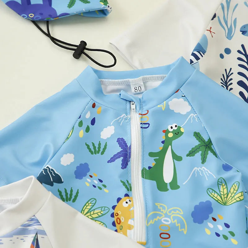 Children's one-piece jumpsuit swimsuit with matching hat in dark blue shark print, made from polyester