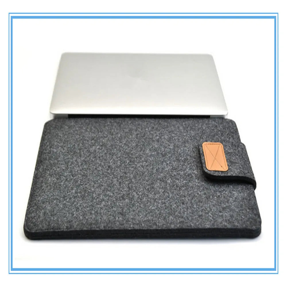 Dark grey clamshell laptop bag open to show plush felt interior for a 14-inch notebook.