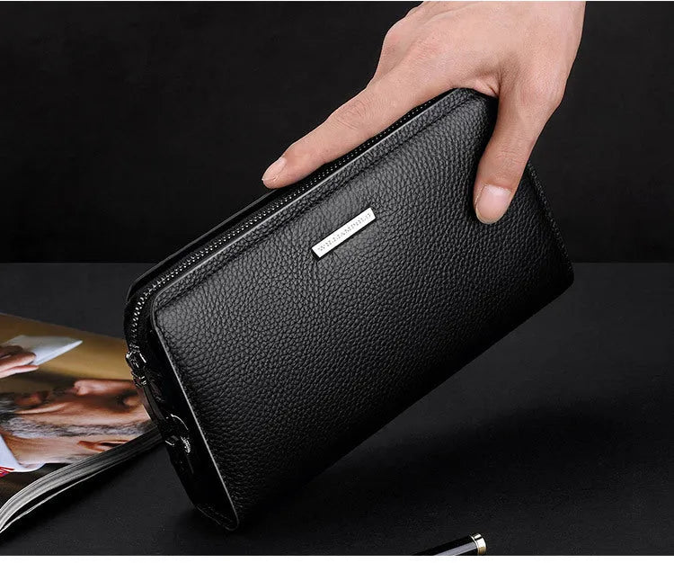 Men's genuine leather clutch wallet with litchi pattern embossing, anti-theft sandwich pocket, and removable handle in black