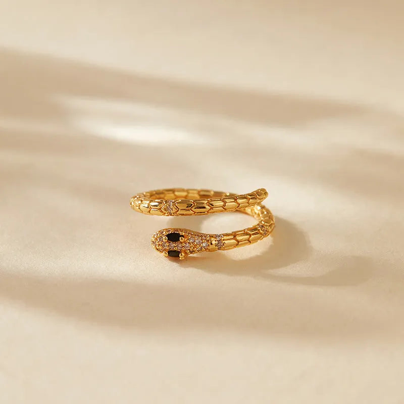 Snake-shaped adjustable copper ring with gold colour plating and diamond surface treatment
