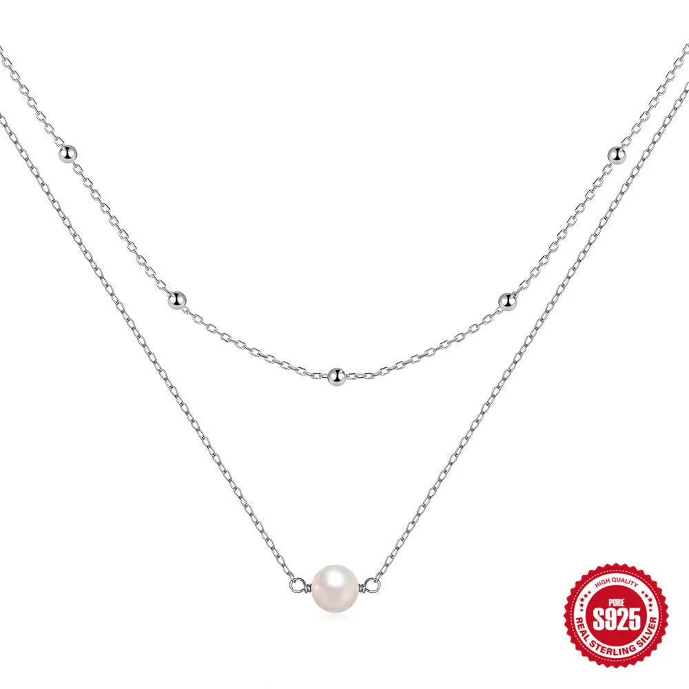 S925 sterling silver double layer necklace with twin pearl geometric pendant on a ball bead chain.