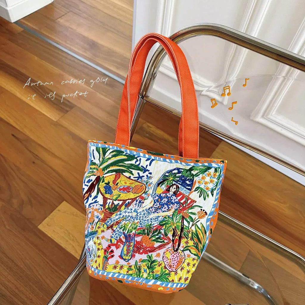 Orange canvas bucket handbag with double shoulder straps and printed letter design