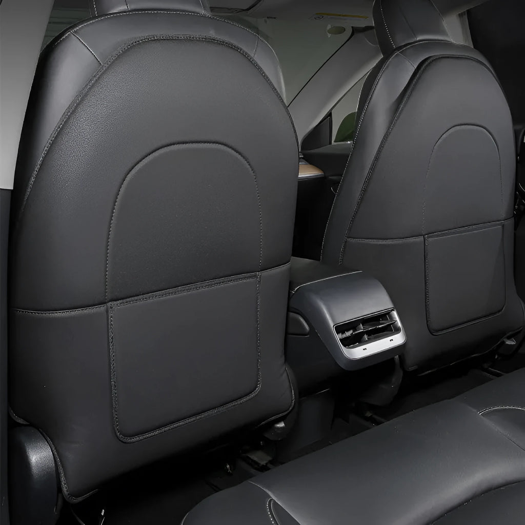 A pair of black leather motorcycle seat kick pads, each with a single pocket.