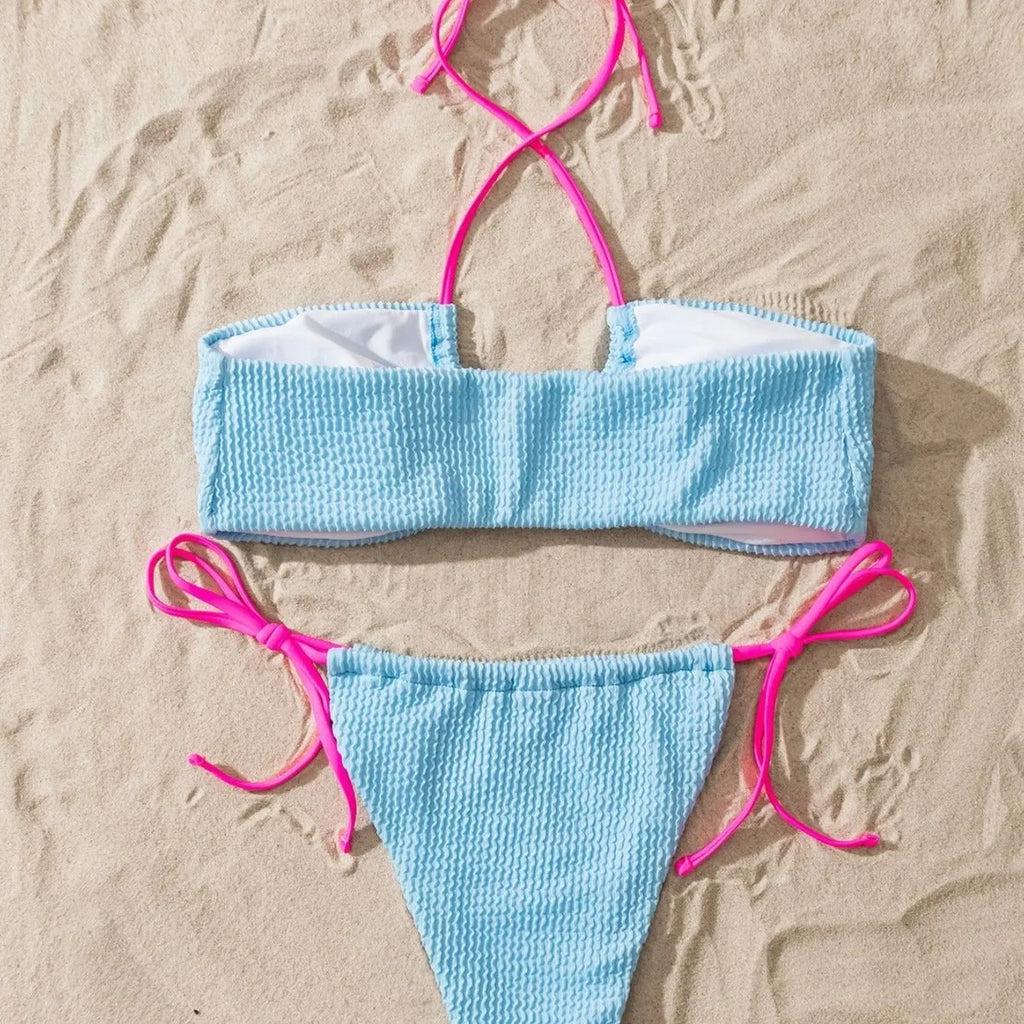 Solid colour women's two-piece swimsuit with lace-up halter top and briefs.