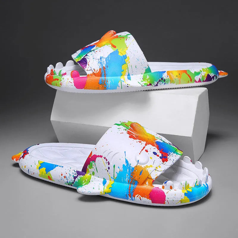 Pair of open-toe EVA home slippers with a shark design on a white background.