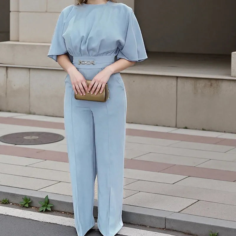 Blue men's two-piece polyester suit on a hanger, showing jacket and trousers.