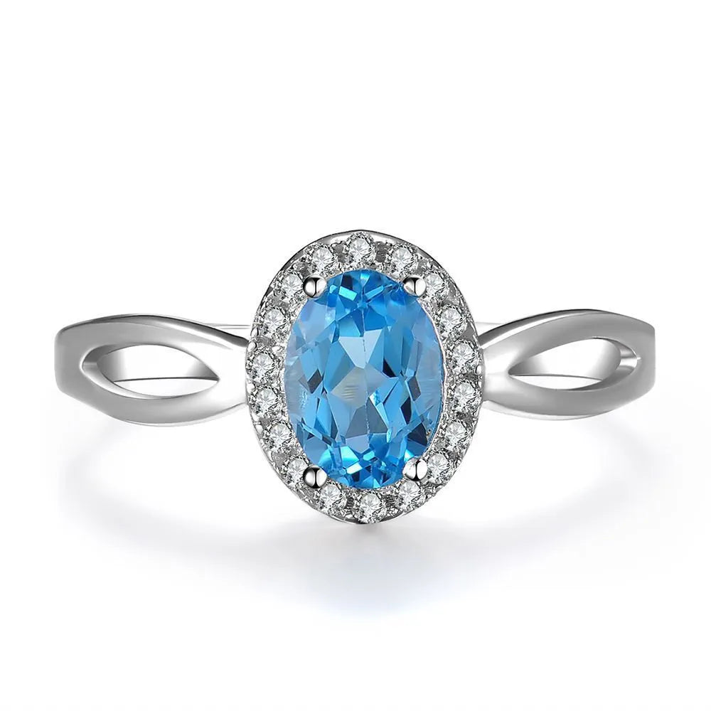 925 sterling silver geometric jewellery set with blue topaz gems including earrings, ring, necklace and pendant