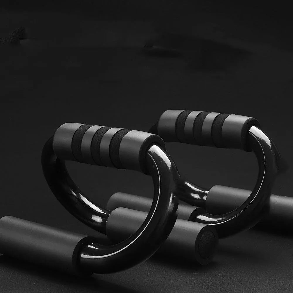 Black S shape push-up bracket rack measuring 20x12x13cm on a flat surface for home exercise