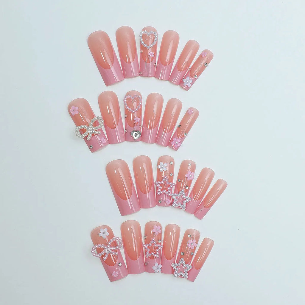 Wearable false nails with love pattern and French spot drill bows in XB-70-48 colour on a plastic armour suit.