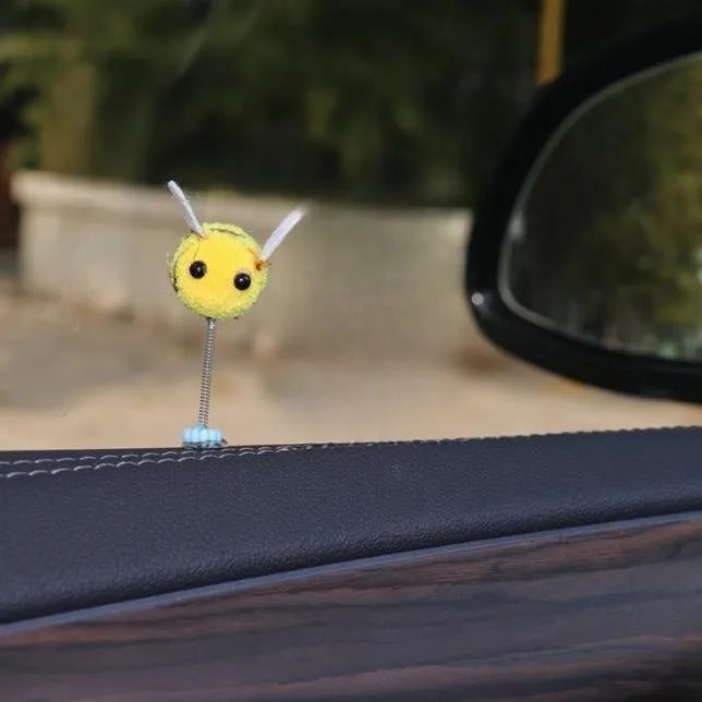 Soft fur ball Swing Spring Bee car decoration ornament measuring 3 by 3 centimetres.