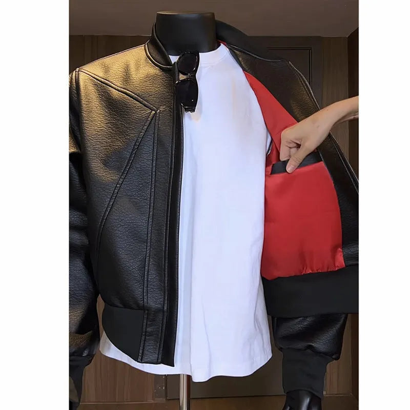 Men's black PU leather motorcycle-style jacket with an extended length and tight fit on a hanger.