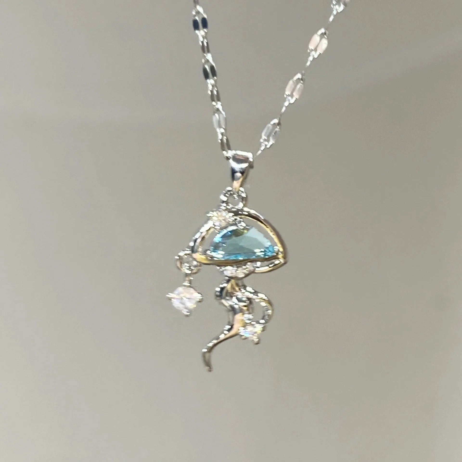 Blue jellyfish charm on sterling silver necklace with adjustable chain