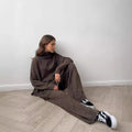 Women's acrylic sweater suit set with side-slit jumper and matching trousers