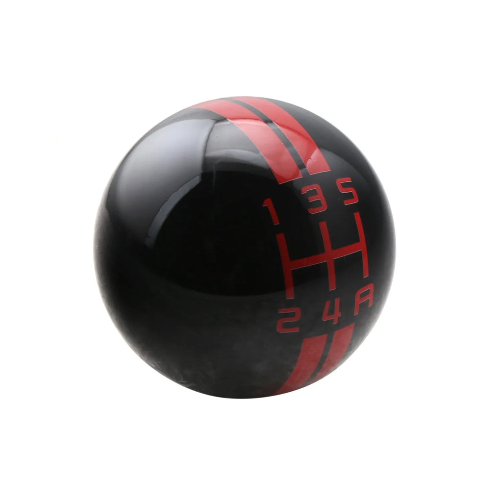Black acrylic car gear head for 5-speed manual transmission, showing red lettering shift pattern.