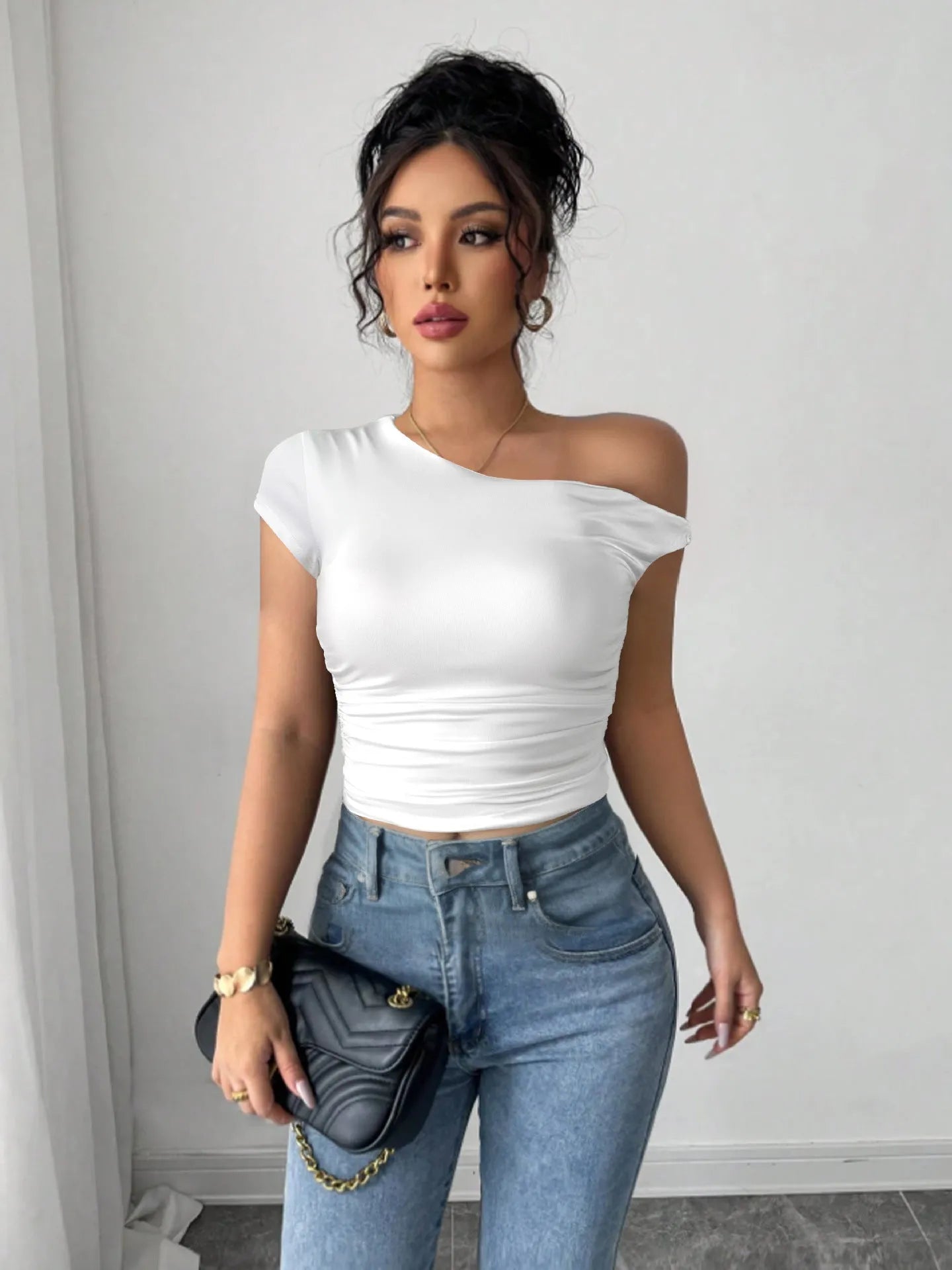 Women's white polyester slim fit pullover top with oblique shoulder neckline and raglan sleeves