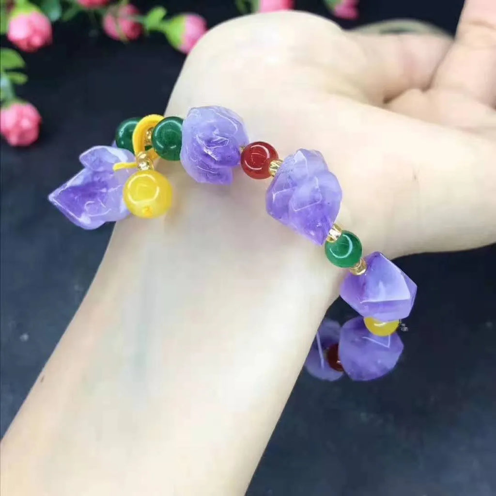 Women's natural amethyst bracelet with a fu character engraved on the central bead.