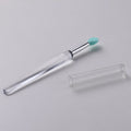 Set of reusable silicone lip brushes with protective caps in various colours on a white background.