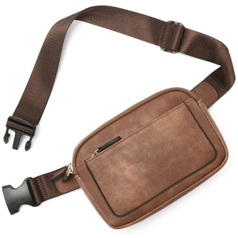 Women's PU leather chest bag in black colour, worn as a crossbody bag with adjustable strap