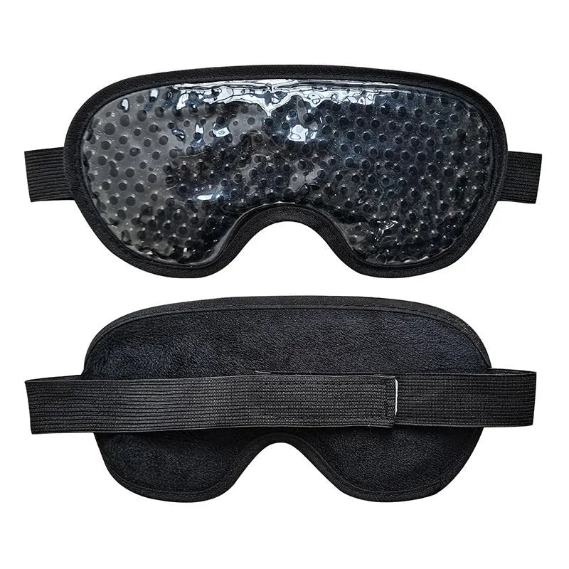 White portable rechargeable eye mask device for hot compress and atomisation, shown with USB cable.