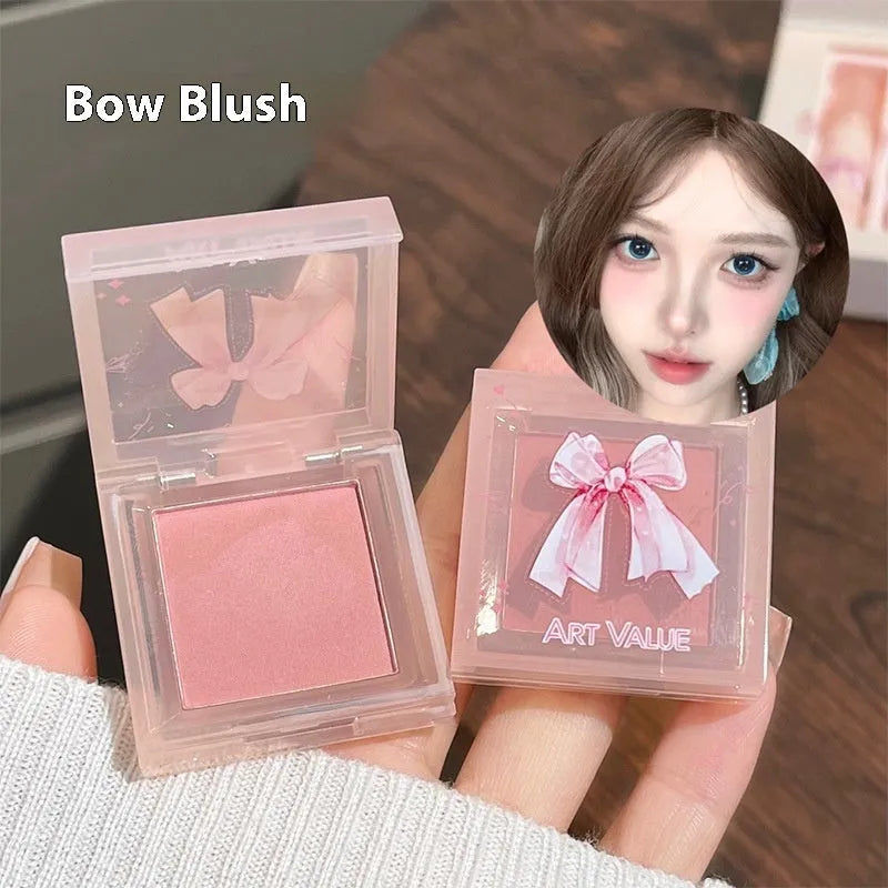 Butterfly Box makeup set showing four matte lip mud tubes, powder blusher compact, and necklace accessory
