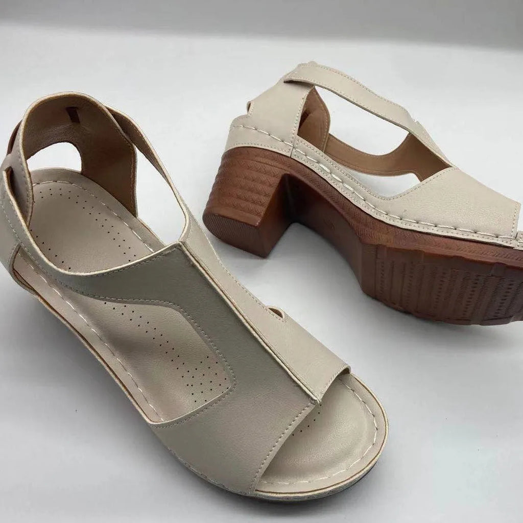 Plus size women's beige peep toe wedge sandals with a buckle strap and low heel.
