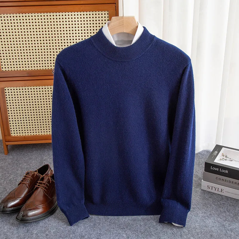 Man wearing a loose fit half-turtleneck wool sweater in a camel colour.