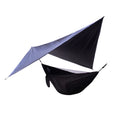 Portable camping hammock with mosquito net and diamond canopy in outdoor setting