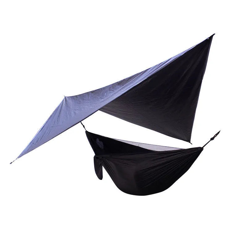 Portable camping hammock with mosquito net and diamond canopy in outdoor setting