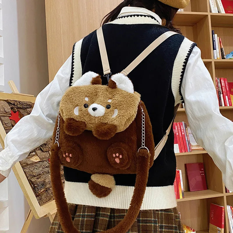 Brown coati plush bag doll cartoon backpack on display showing soft fabric and animal face design