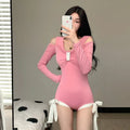 Women's long-sleeved one-piece swimsuit in polyester fabric, available in pink or black colours