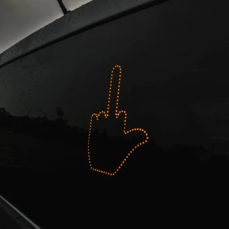 Black plastic LED gesture light for cars with remote control showing middle finger symbol