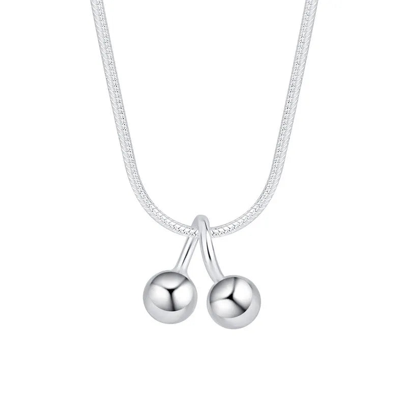 Silver cherry pendant necklace for women with adjustable snake chain.