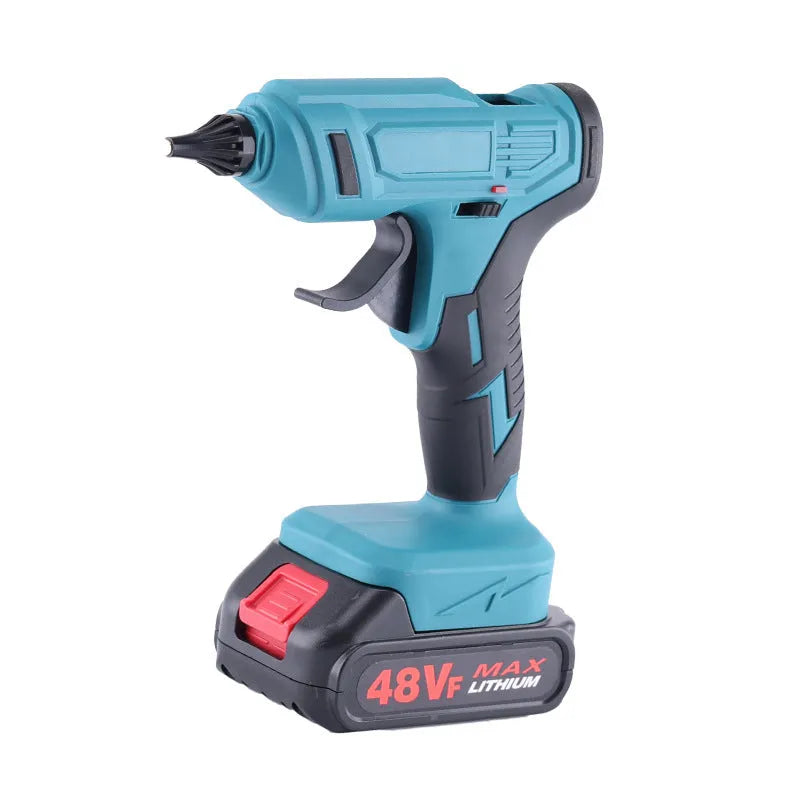 Rechargeable hot melt glue gun with lithium batteries and glue sticks on work surface