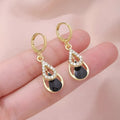 Black diamond-inlaid drop earrings with hollow double-layer alloy droplet design for women