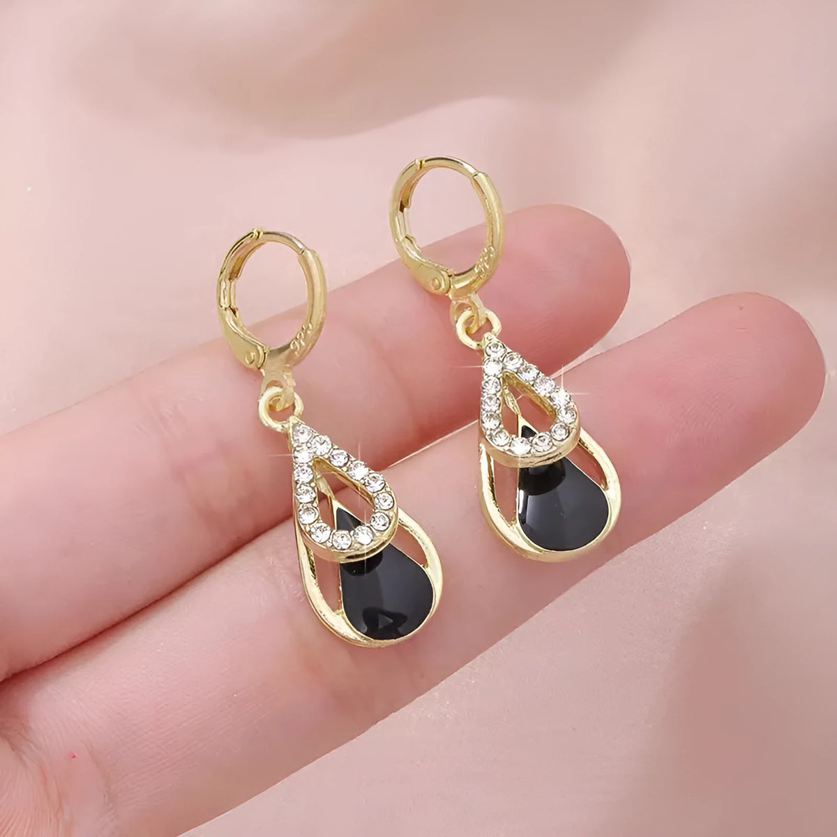 Black diamond-inlaid drop earrings with hollow double-layer alloy droplet design for women