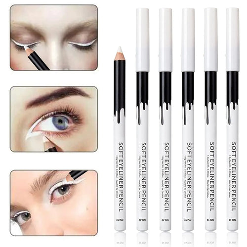 12 white and black retractable eyeliner pencils and a sharpener laid out on a flat surface.
