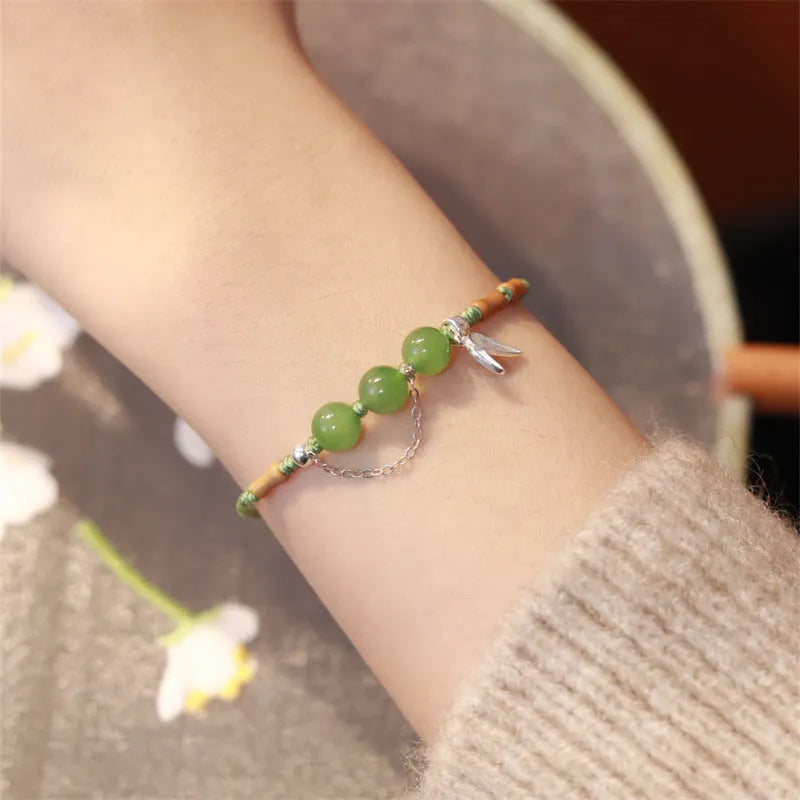 Women's diamond shape Hetian jade bracelet with woven carrying strap in light green or haze blue
