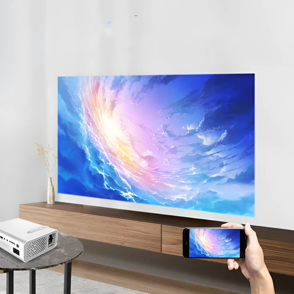 Black YG530 mini wireless mobile phone projector showing a projected image on a wall.