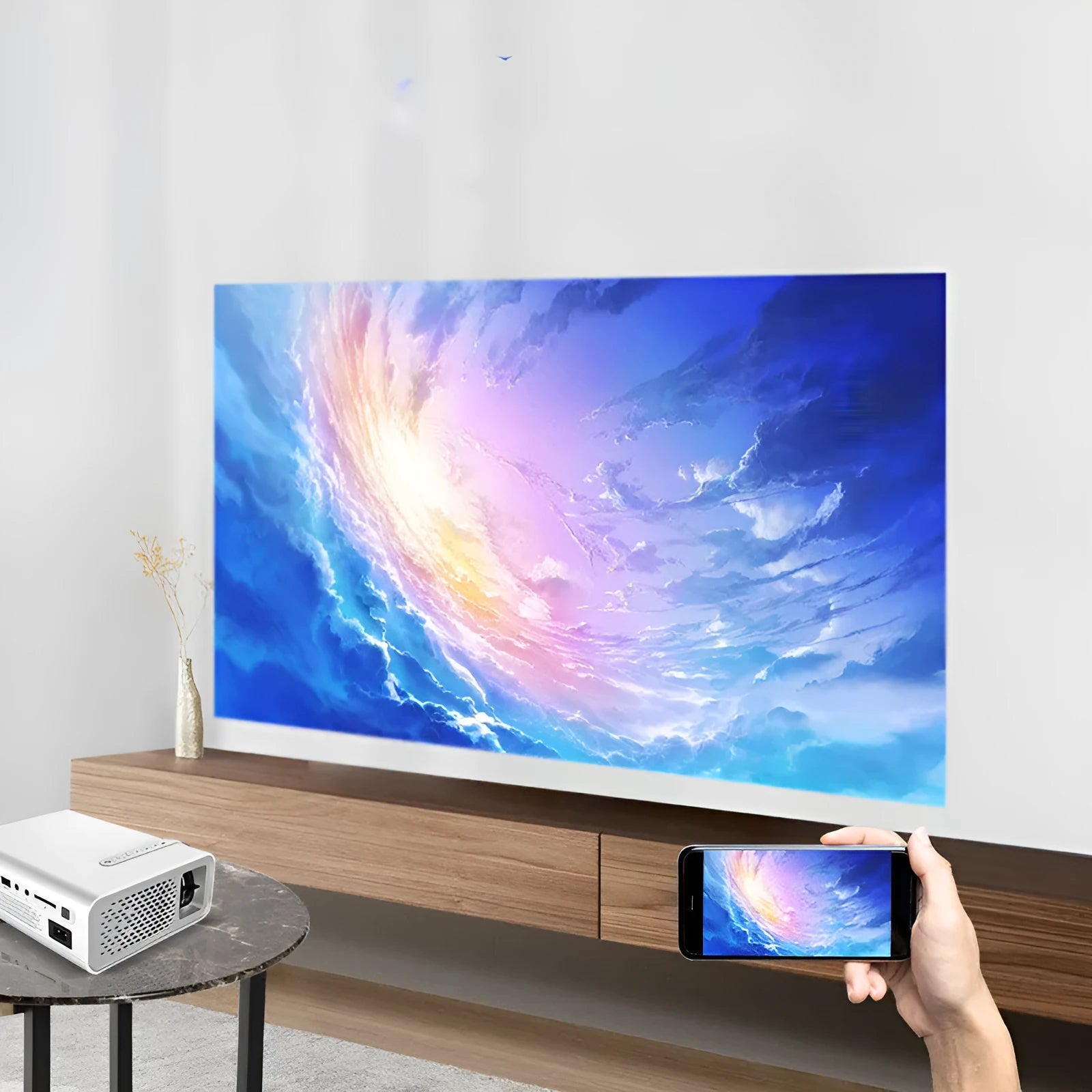 Black YG530 mini wireless mobile phone projector showing a projected image on a wall.