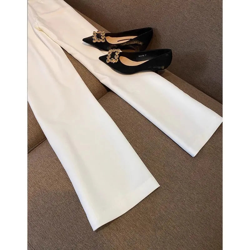White polyester women's formal suit set with blazer top and matching trousers