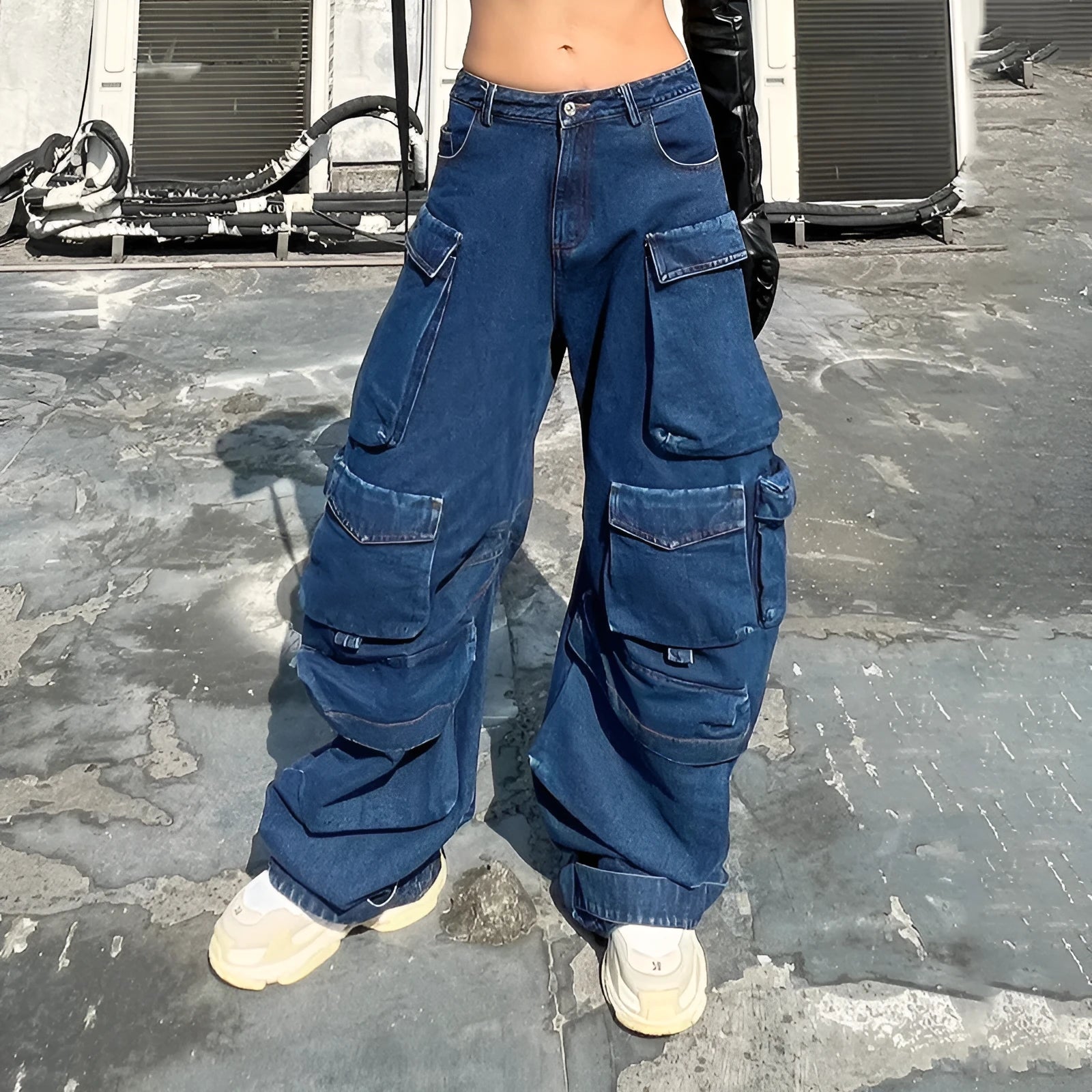 Dark blue distressed wide-leg jeans with a high waist and multiple pockets laid flat