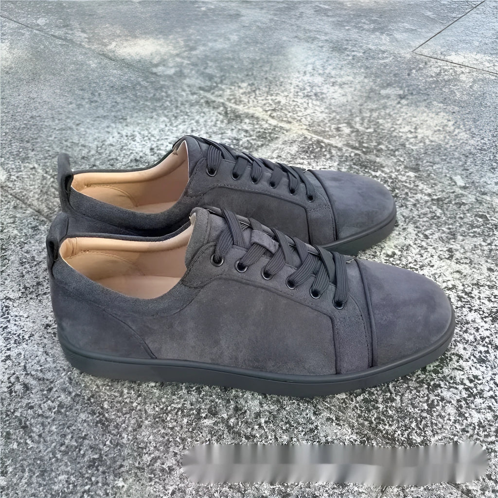 Men's grey low-top casual sneakers with colour-block design, stitched rubber sole, and front lacing