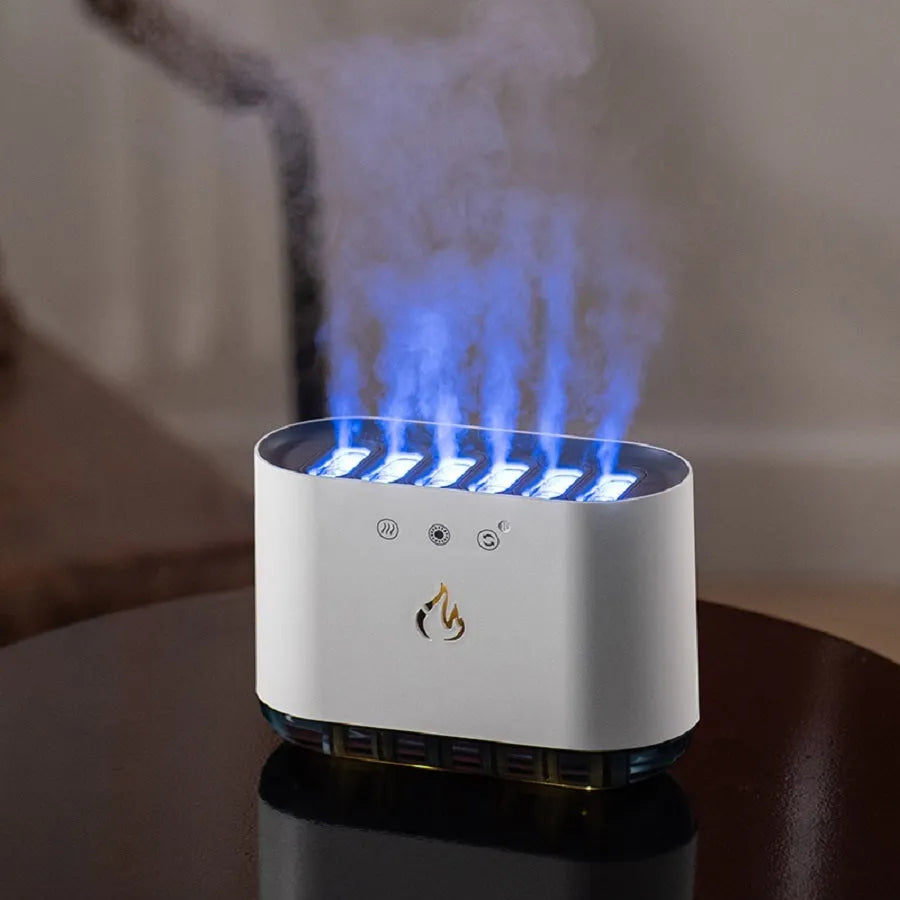 White large-capacity humidifier with colourful LED atmosphere lamp and aromatherapy diffuser on a table.